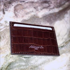 Brown leather cardholder.